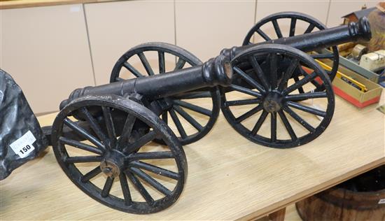 A pair of cast metal cannons length 73cm